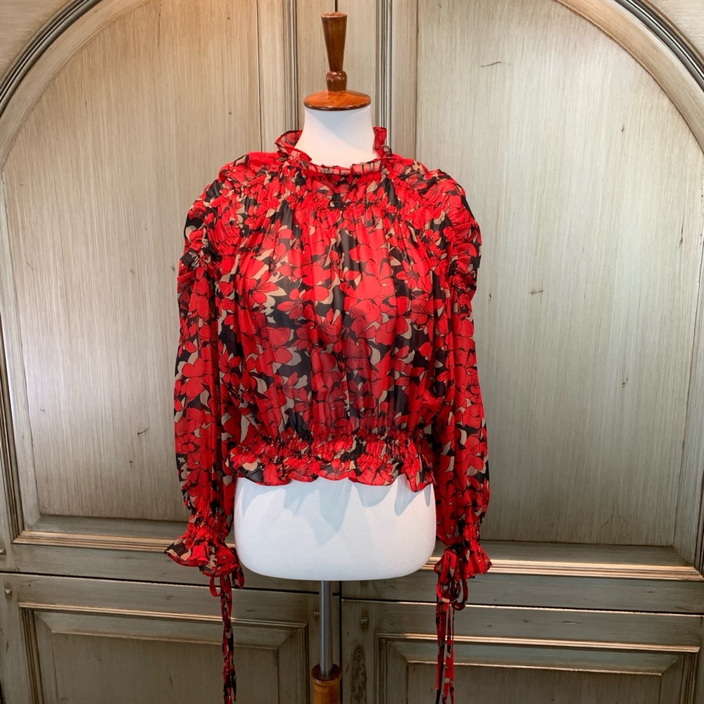 Floral crop top. I think size med. purchased at Buffalo exchange in California.